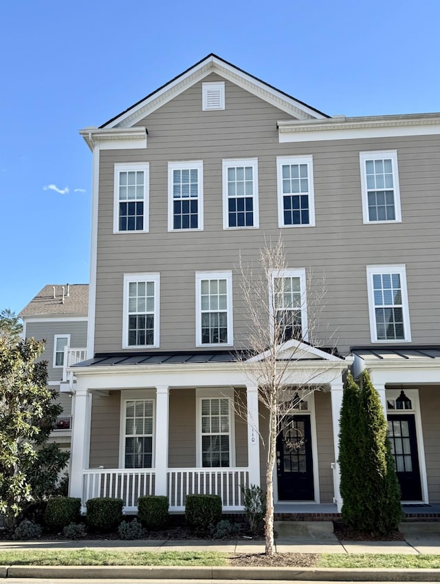 view of front of home featuring covered porch, metal roof, and a standing seam roof