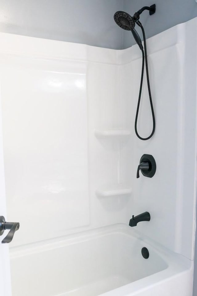 bathroom with washtub / shower combination