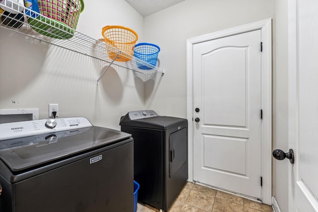 laundry room featuring laundry area and washer and clothes dryer