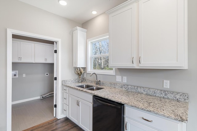 kitchen featuring white cabinets, dishwasher, light stone counters, a sink, and recessed lighting