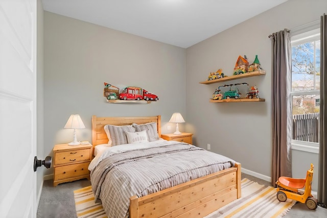 bedroom with carpet and baseboards