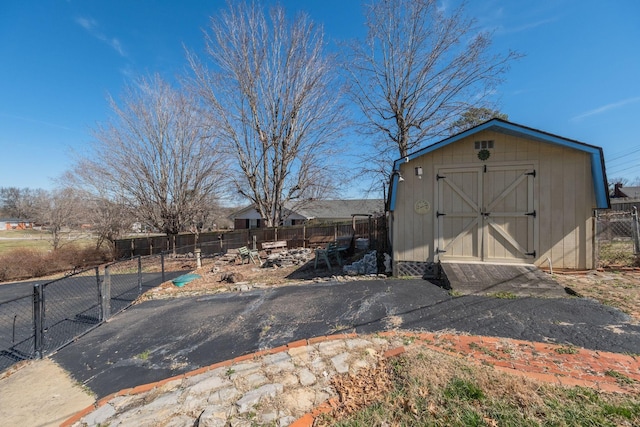 view of shed featuring fence