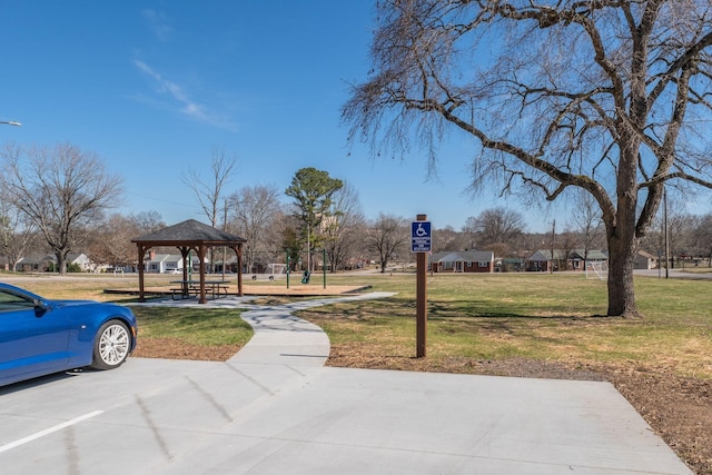 view of property's community with a yard and a gazebo