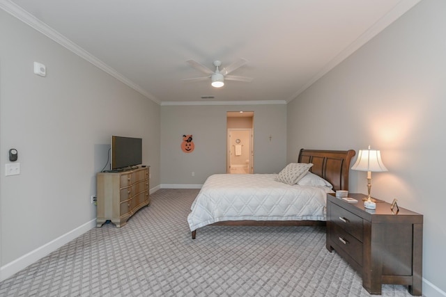 bedroom featuring light carpet, crown molding, and baseboards