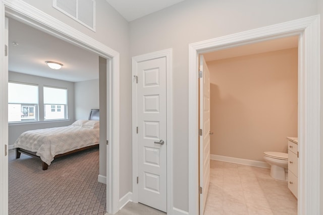 bedroom featuring visible vents and baseboards