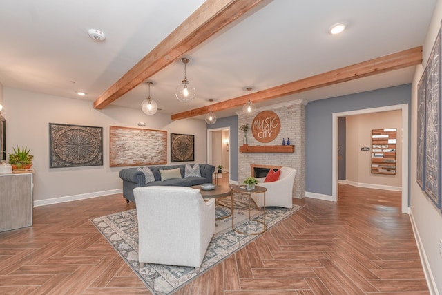 living room with beamed ceiling, a brick fireplace, and baseboards