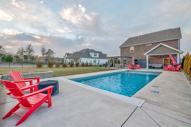 view of swimming pool featuring a fenced in pool, a yard, a patio, fence, and an outdoor living space