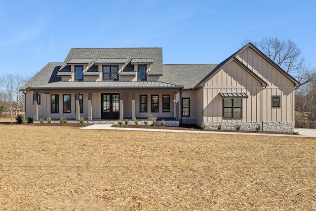 modern farmhouse style home with board and batten siding, a standing seam roof, metal roof, and a shingled roof