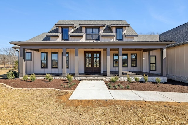 998 Iron Hill Rd, Burns, TN 37029 - view of front facade featuring board and batten siding, french doors, covered porch, and a shingled roof