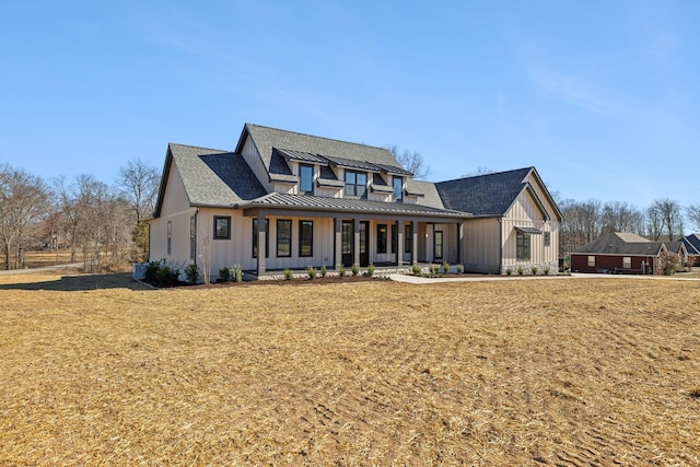 998 Iron Hill Rd, Burns, TN 37029 - modern farmhouse featuring board and batten siding, a front yard, a standing seam roof, and metal roof