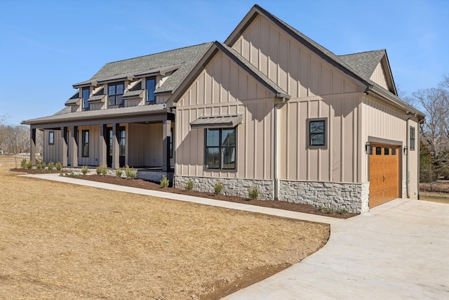 998 Iron Hill Rd, Burns, TN 37029 - modern inspired farmhouse with an attached garage, a shingled roof, board and batten siding, and concrete driveway