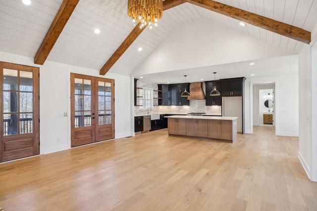998 Iron Hill Rd, Burns, TN 37029 - kitchen with open floor plan, light countertops, french doors, open shelves, and custom range hood