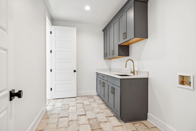 998 Iron Hill Rd, Burns, TN 37029 - clothes washing area with cabinet space, baseboards, washer hookup, a sink, and recessed lighting