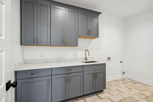 998 Iron Hill Rd, Burns, TN 37029 - clothes washing area with hookup for an electric dryer, washer hookup, a sink, baseboards, and cabinet space