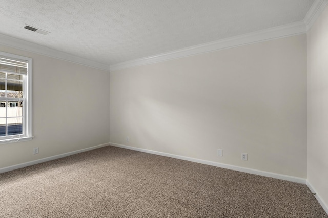 carpeted spare room with a textured ceiling, ornamental molding, visible vents, and baseboards