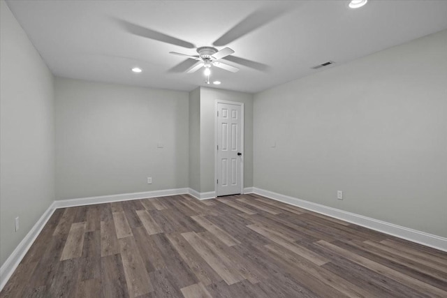 empty room with ceiling fan, recessed lighting, wood finished floors, visible vents, and baseboards