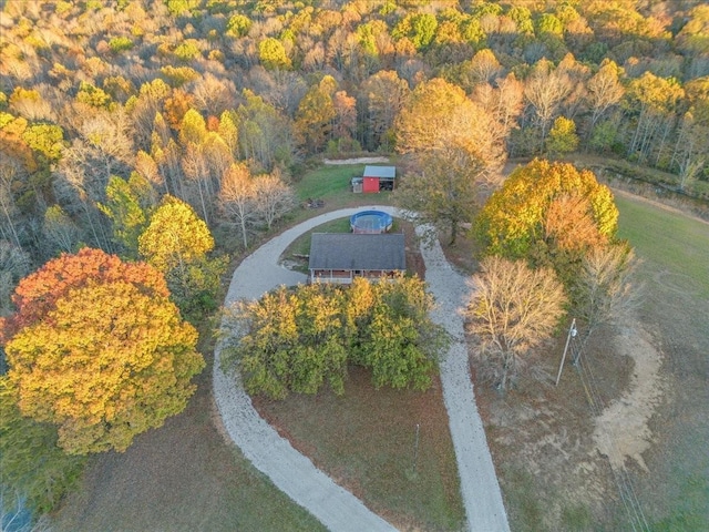 drone / aerial view featuring a forest view