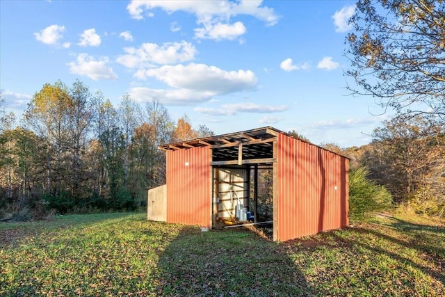 view of pole building with a yard