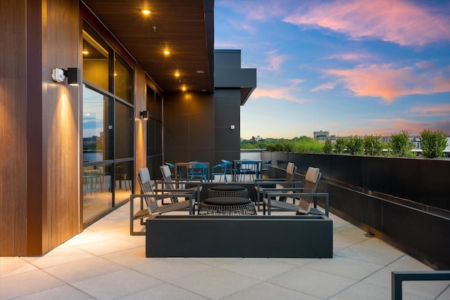 patio terrace at dusk featuring outdoor dining space