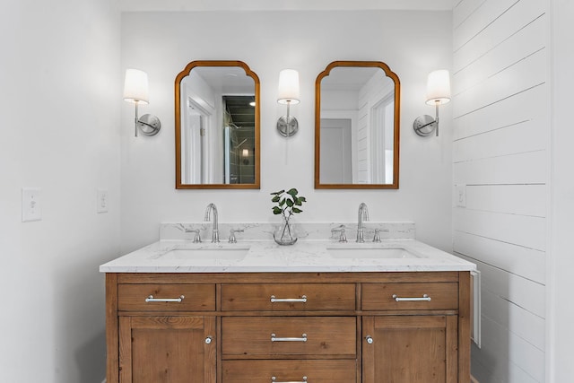 full bath with a sink and double vanity