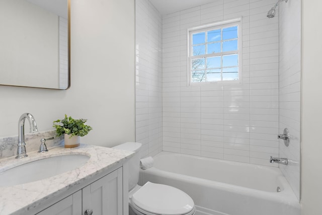 full bathroom featuring toilet, vanity, and bathing tub / shower combination