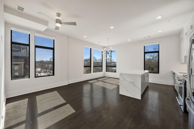 interior space featuring dark wood-style floors, plenty of natural light, and recessed lighting