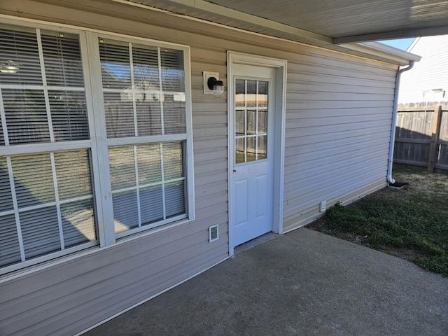 property entrance with fence