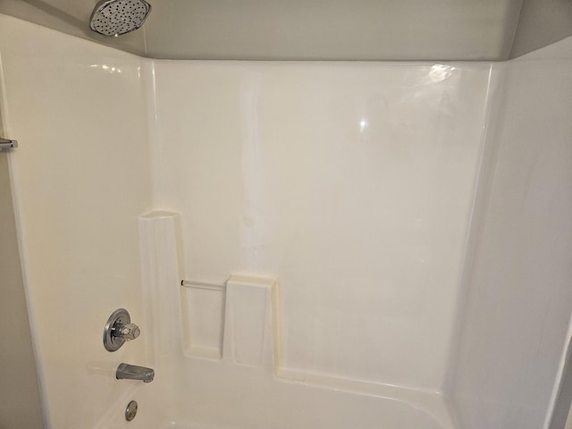 full bathroom with shower / washtub combination