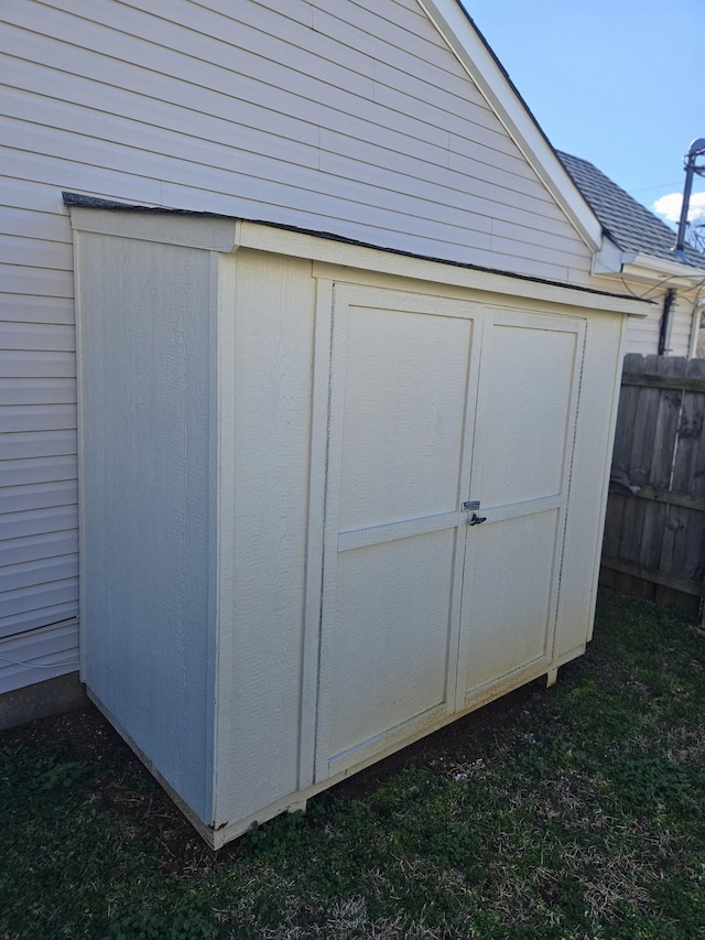 view of shed with fence