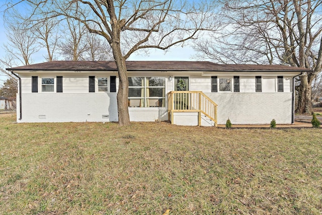 single story home featuring crawl space, a front lawn, and brick siding