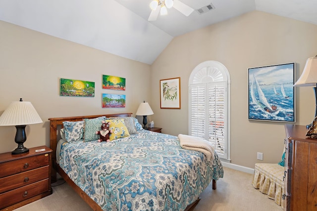 bedroom with visible vents, baseboards, light colored carpet, ceiling fan, and vaulted ceiling