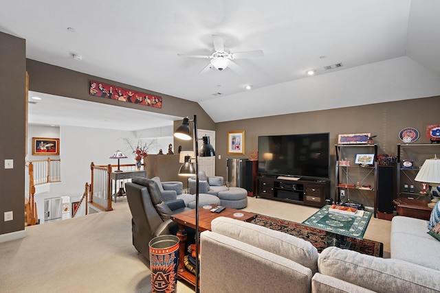 living area with carpet, visible vents, vaulted ceiling, and ceiling fan