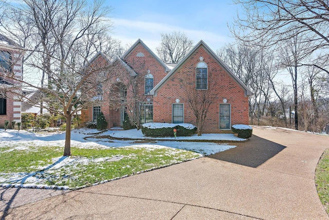 view of front of home featuring brick siding