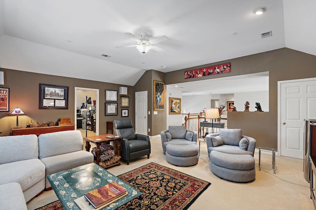 living area featuring lofted ceiling, light carpet, and visible vents