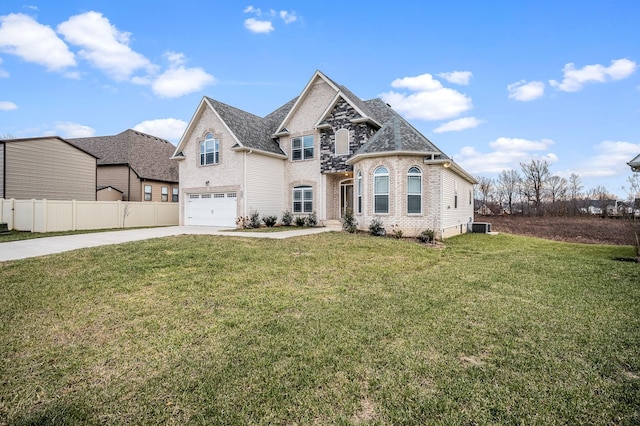 view of front facade featuring driveway, brick siding, an attached garage, fence, and a front yard