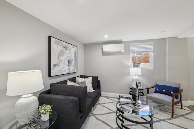 living room with an AC wall unit, recessed lighting, and baseboards