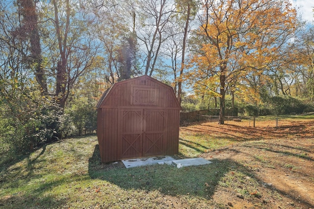 view of shed with fence