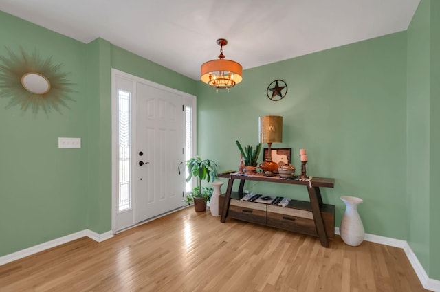 entrance foyer with wood finished floors and baseboards