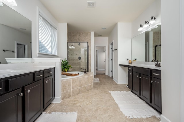 full bathroom with a garden tub, visible vents, a stall shower, a sink, and tile patterned floors