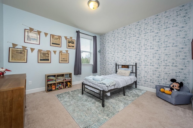 carpeted bedroom featuring baseboards