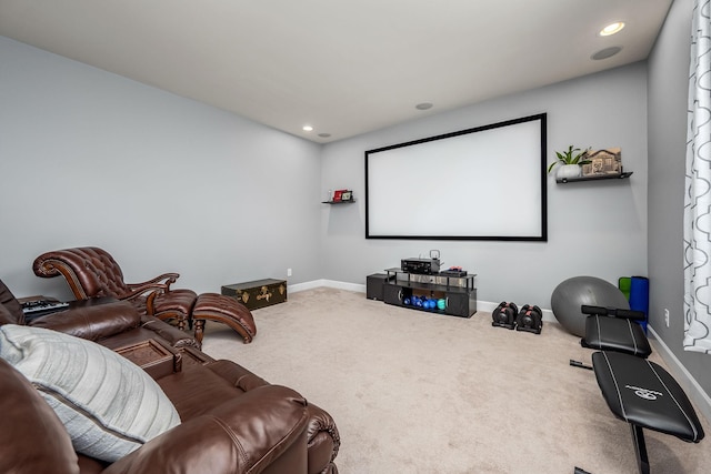 carpeted cinema room with recessed lighting and baseboards