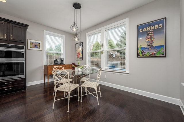 dining space with dark wood-style floors and baseboards