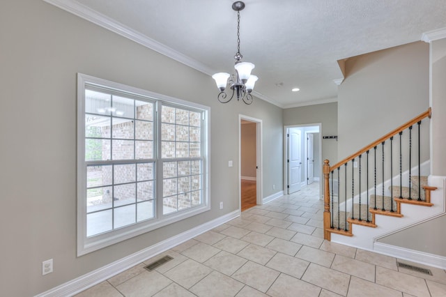 foyer featuring a notable chandelier, visible vents, and a wealth of natural light