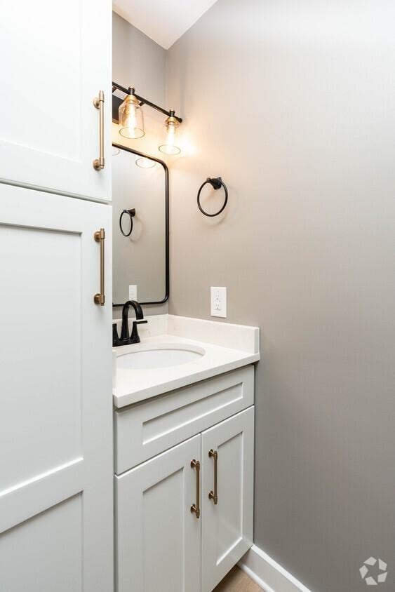 bathroom featuring vanity and baseboards