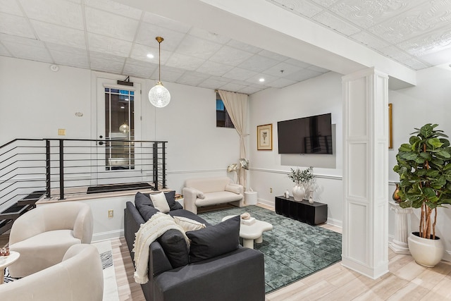 living area featuring recessed lighting, wood finished floors, and baseboards