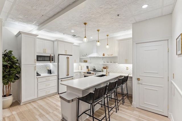 kitchen with stainless steel appliances, a sink, decorative backsplash, open shelves, and an ornate ceiling