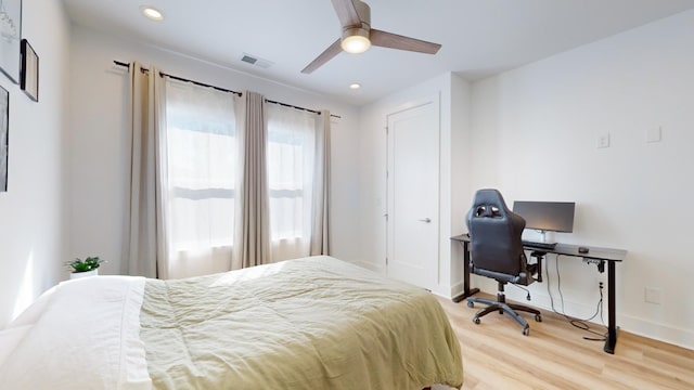 bedroom with ceiling fan, recessed lighting, visible vents, baseboards, and light wood-style floors