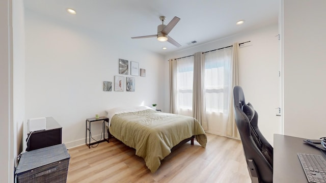 bedroom with baseboards, recessed lighting, visible vents, and light wood-style floors