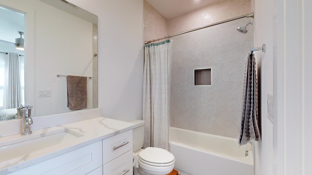 bathroom with toilet, shower / tub combo, vanity, and visible vents