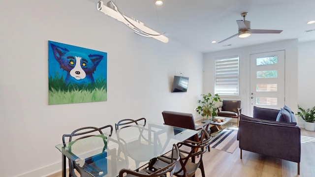 dining room with ceiling fan, baseboards, wood finished floors, and recessed lighting